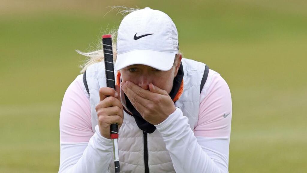 Norway’s Suzann Petterson lines up her putt on the 14th green as she defies the elements playing in the second round of the Women’s British Open Golf Championships in Turnberry. Photograph: Getty Images