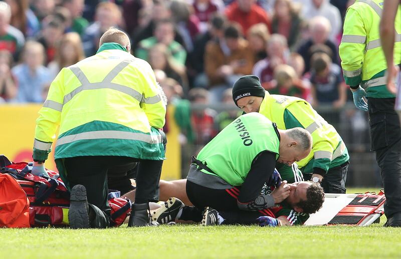 Tom Parsons receives medical treatment after suffering a serious knee injury in the 2018 Connacht quarter-final against Galway at Elvery's McHale Park, Castlebar. Photograph: Cathal Noonan/Inpho