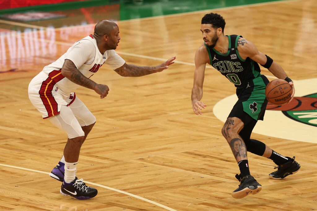 Jayson Tatum of the Boston Celtics dribbles against P.J. Tucker of the Miami Heat. Photograph: Maddie Meyer/Getty