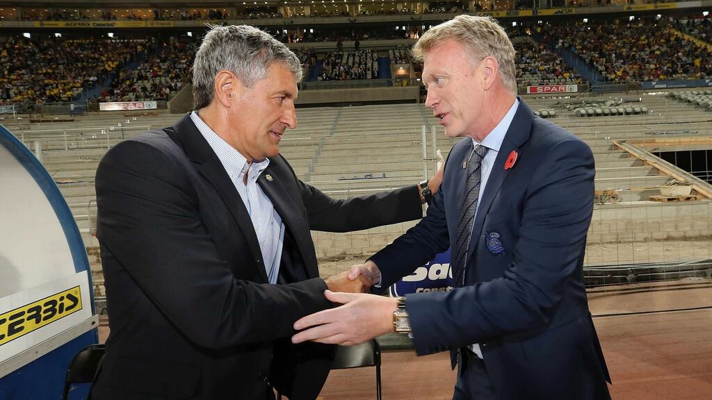 Real Sociedad’s coach David Moyes shakes hands with Las Palmas coach Quique Setien at the beginning of the Spanish Primera Division soccer match. The Scot was sacked by the Basque club on Monday. Photograph: Elvira Urquijo/EPA