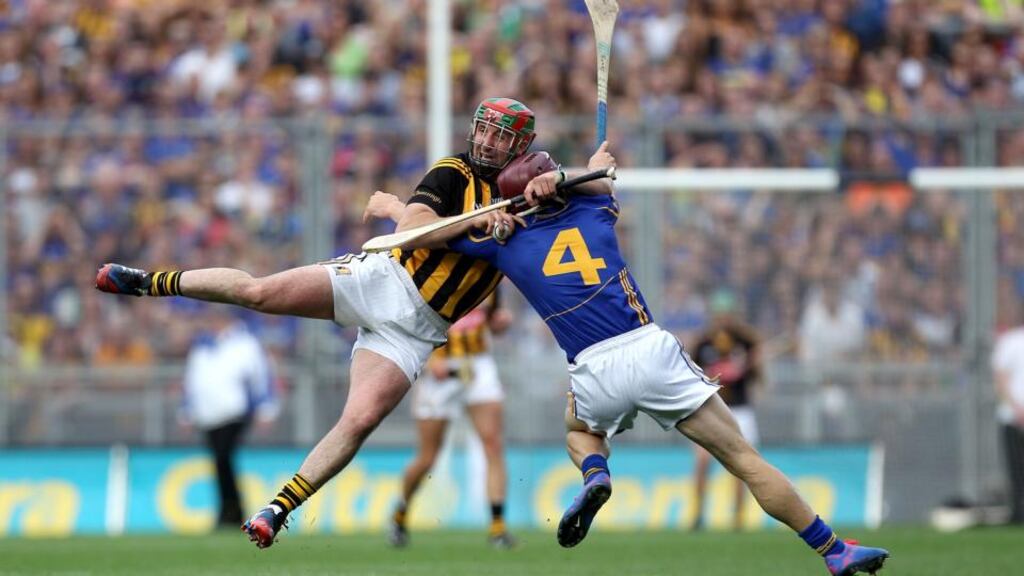 Kilkenny’s Eoin Larkin and Paddy Stapleton of Tipperary collide in the drawn All-Ireland hurling final on September 7th at Croke Park.  Photograph: Ryan Byrne / Inpho