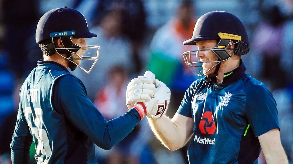 England’s Joe Root celebrates making his century with his captain Eoin Morgan, from Dublin. Photograph: PA