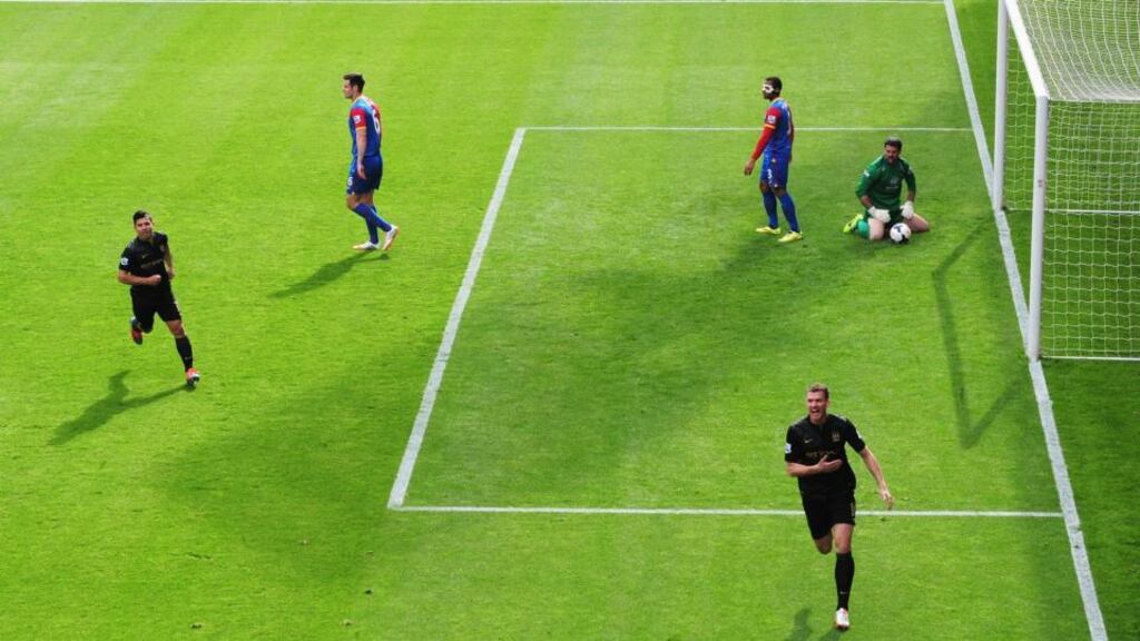 Manchester City striker Edin Dzeko celebrates scoring the opening goal during the Premier League match against Crystal Palace at Selhurst Park. Photograph: Jamie McDonald/Getty Images