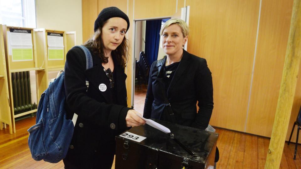 Una Mullally with her partner Sarah Francis voting in the marriage referendum in Pearse Street, Dublin. Photograph: Alan Betson