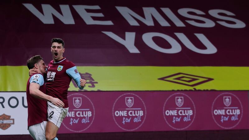 Burnley’s Chris Wood celebrates scoring their third goal with Matthew Lowton during the Premier League win over Aston Villa. Photo: Molly Darlington/POOL/AFP via Getty Images