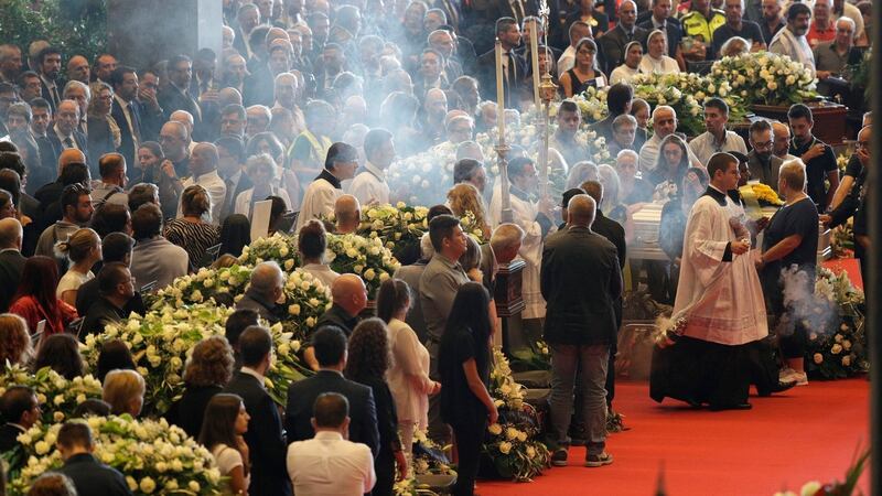 A funeral service for victims of the collapsed highway bridge, in Genoa’s exhibition centre. Photograph: AP
