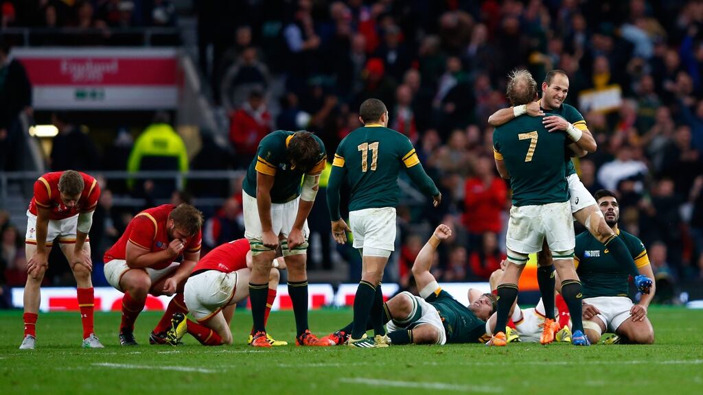 Fourie Du Preez and Schalk Burger embrace after South Africa’s Rugby World Cup quarter-final win over Wales. Photograph: Getty