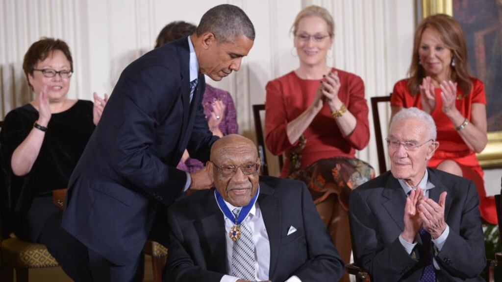 US President Barack Obama presents the Medal of Freedom to former professional golfer Charles Sifford. He was the first African-American to earn a PGA card.   Photograph:  Mandel Ngan/AFP/Getty Images