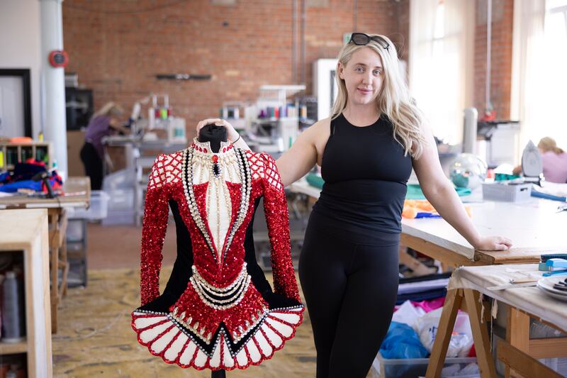 Dress designer and director Tomasina Smyth with one of her designs in Rosemount Factory. Photograph: Joe Dunne