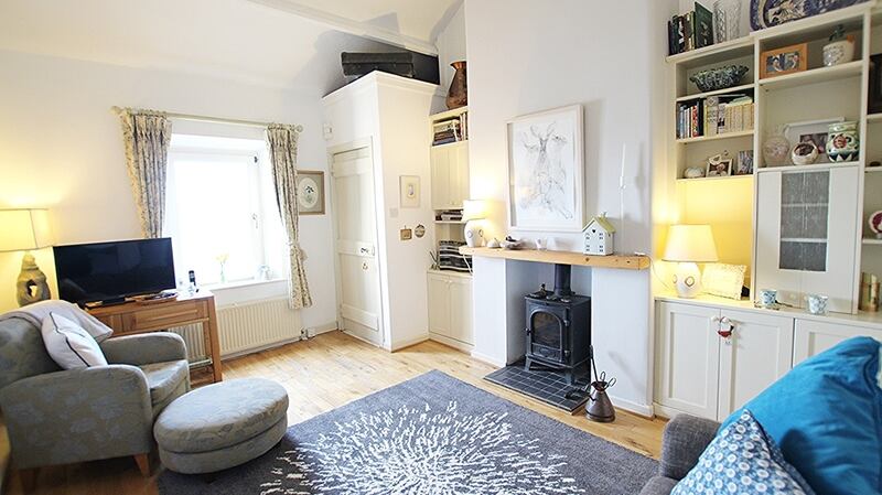 The livingroom of 14 Station Road Cottages with its wood fired stove