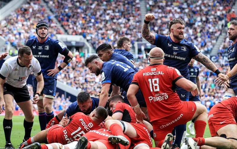 Leinster’s Andrew Porter celebrates Josh van der Flier scoring their try. Photograph: Dan Sheridan/Inpho
