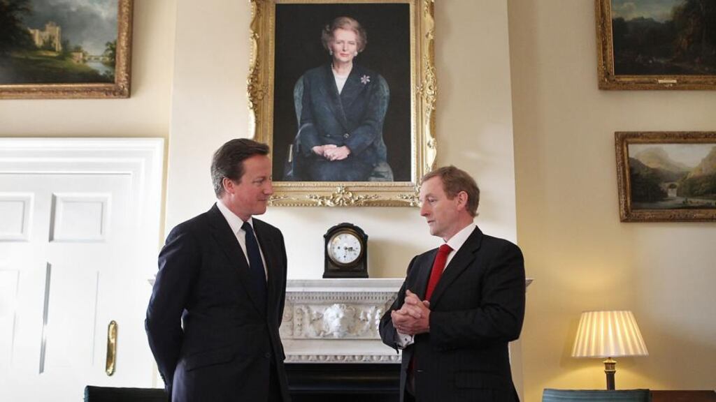 Taoiseach Enda Kenny meets British Prime Minister David Cameron under a portrait of former Prime Minister Margaret Thatcher at 10 Downing Street in 2011