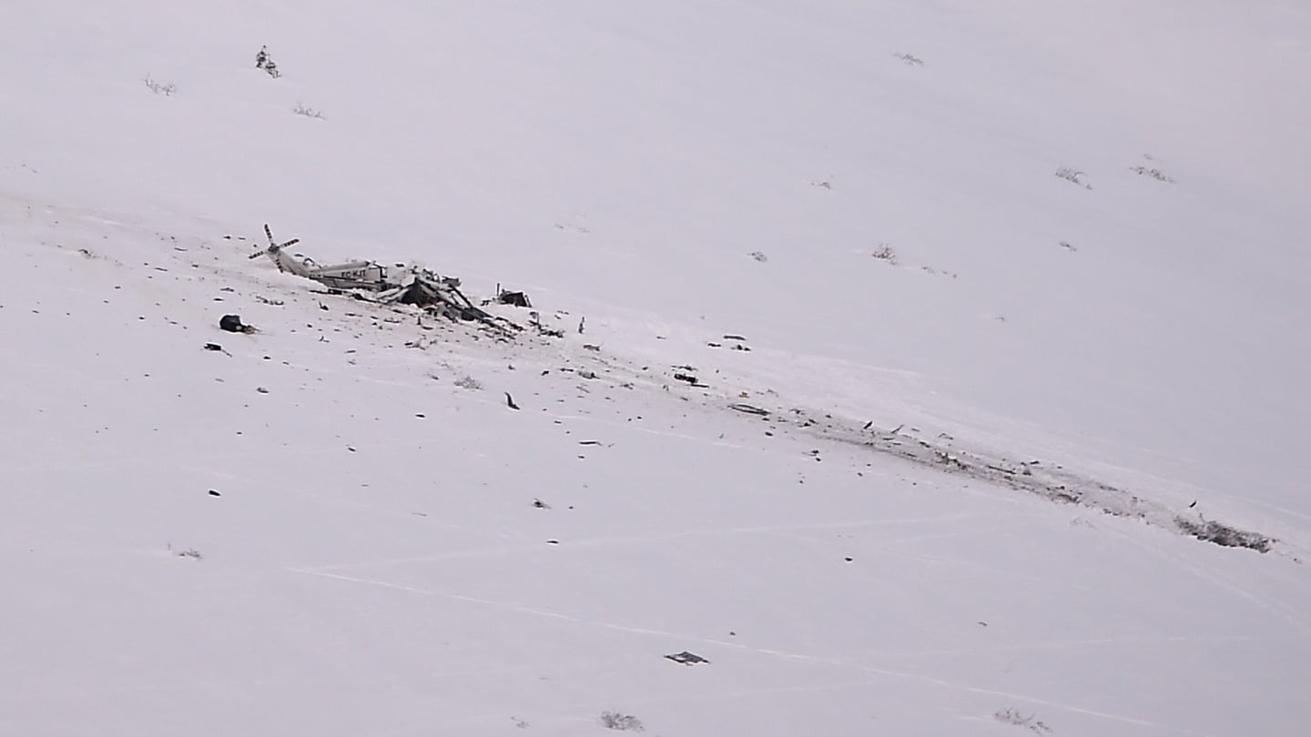The wreck of a helicopter following a crash  in the mountains on Tuesday near the ski resort of Campo Felice, central Italy. Six people onboard were killed.  Photograph: Filippo Monteforte/AFP/Getty Images