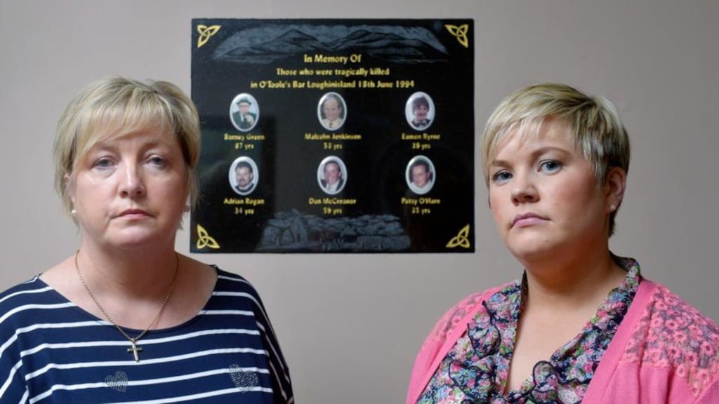 Left behind: Emma and Claire Rogan, the daughter and wife of Adrian Rogan, at the Heights Bar. Photograph: Colm Lenaghan/Pacemaker