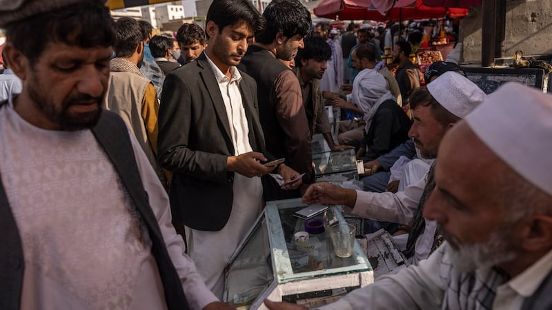 Money changers do business in Kabul on August 21st. Photograph: Victor J Blue/New York Times