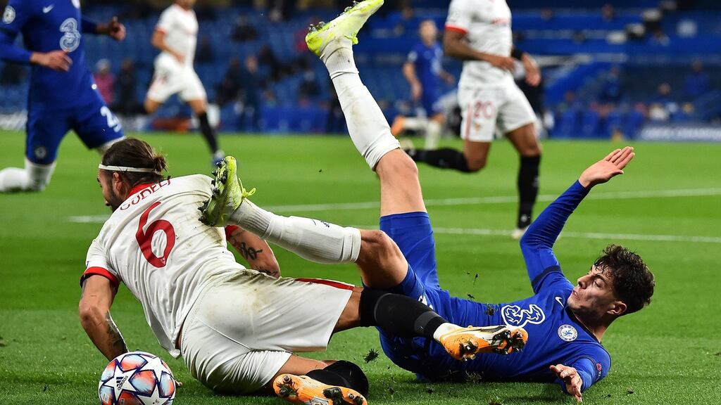 Kai Havertz of Chelsea is fouled by Nemanja Gudelj of Sevilla during their Uefa Champions League Group E draw at Stamford Bridge. Photo: Glyn Kirk - Pool/Getty Images