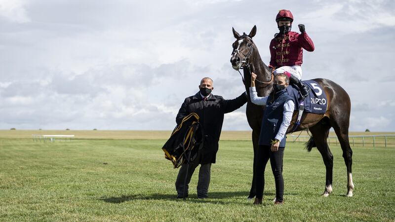 Jockey Oisin Murphy celebrates with stable staff after victory. Photograph: Getty Images