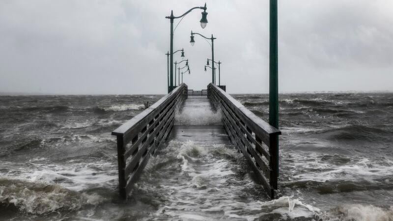 Strong gusts of wind and bands of heavy rain cover a walkway at the Jensen Beach Causeway Park in Jensen Beach, Florida. Photograph: Getty Images