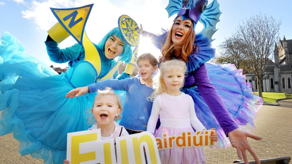 Artastic Pageant characters Piyanuch Chanphet and  Rachel Lalley with Rebecca, Denis and Anabelle Johnson from Dublin at the launch of the St Patrick’s Festival 2017. Photograph: Alan Betson