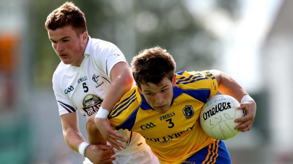 Kildare’s Jamie Flynn tries to tackle Roscommon’s Sean Mullooly during the Electric Ireland
GAA Football
All-Ireland minor quarter-final at O’Connor Park yesterday.
Photograph: Ryan Byrne/Inpho