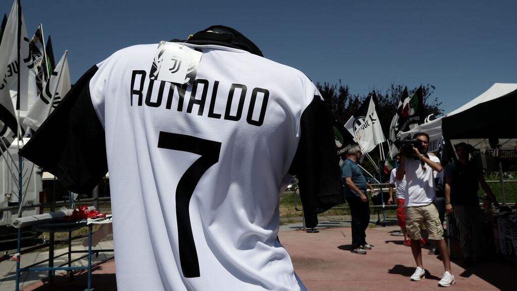 A picture taken in Turin shows a Cristiano Ronaldo’s Juventus T-shirt in a stand near the Allianz Stadium as his move from Real Madrid is finalised. Photo: Isabella Bonotto/Getty Images