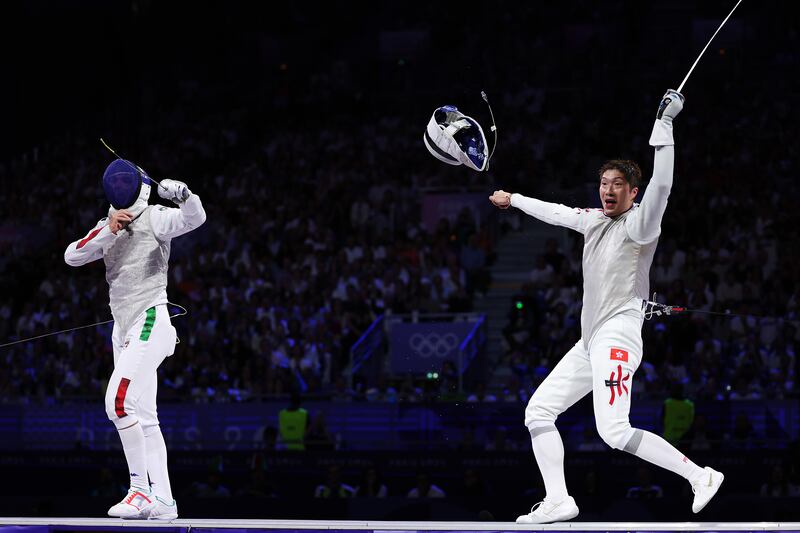 Ka Long Cheung of team Hong Kong celebrates victory over Italy's Filippo Macchi in the fencing men's foil final at Grand Palais in Paris. Photograph: Al Bello/Getty Images