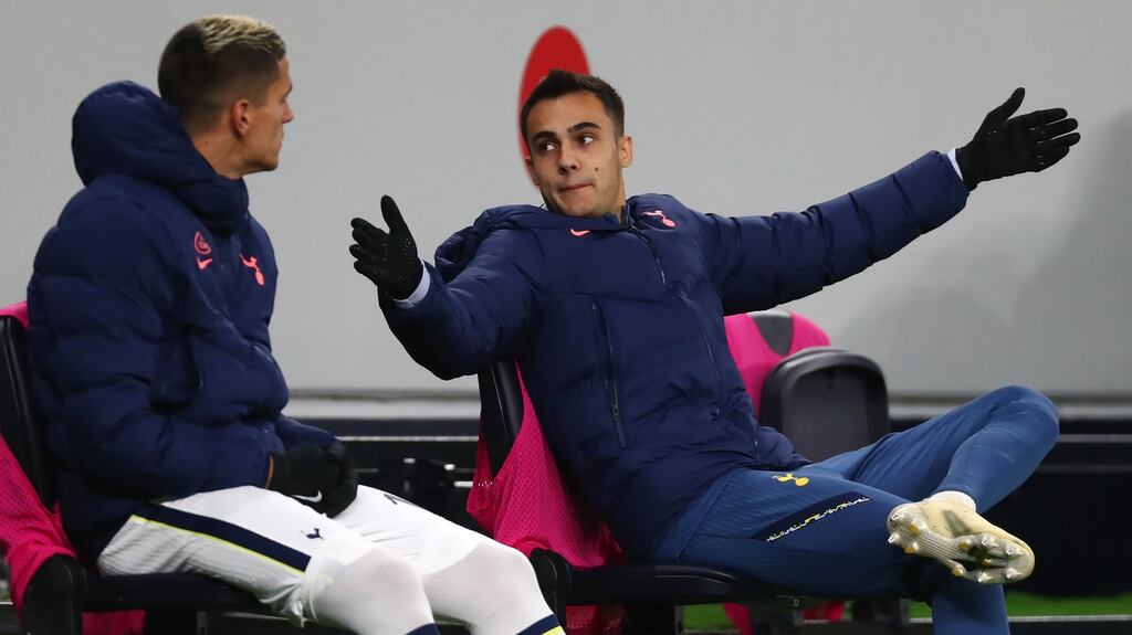 Is Sergio Reguilón showing Erik Lamela the size of his ham? Photo: Clive Rose/PA Wire