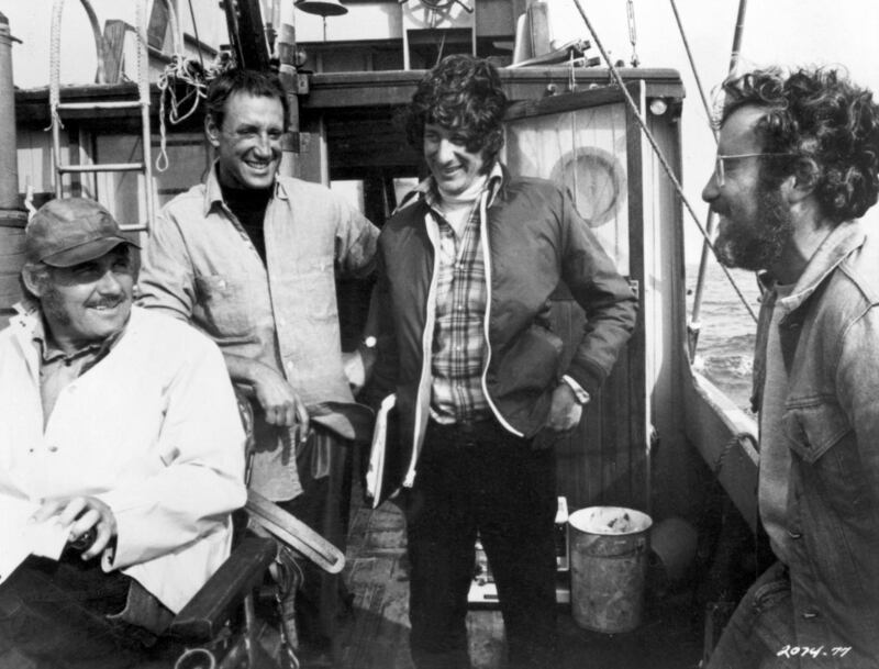 Robert Shaw, Roy Scheider, Steven Spielberg and Richard Dreyfuss laugh together on a boat during the filming of Jaws. Photograph: Universal Studios/Getty Images