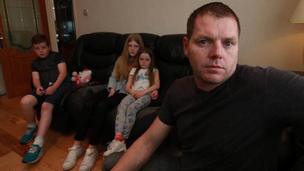 The O’Connor Family at home in Tallaght (from Left) Scott (10), Sophie (15), Stacey (8) and their father, Daniel O’Connor. Photograph: Nick Bradshaw