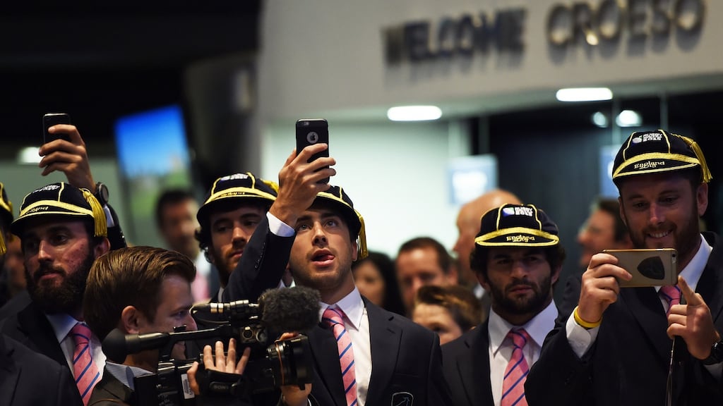 Uruguay’s rugby players take pictures with their smartphones during the team’s official welcoming ceremony before the Rugby World Cup in 2015. Photo: Getty Images
