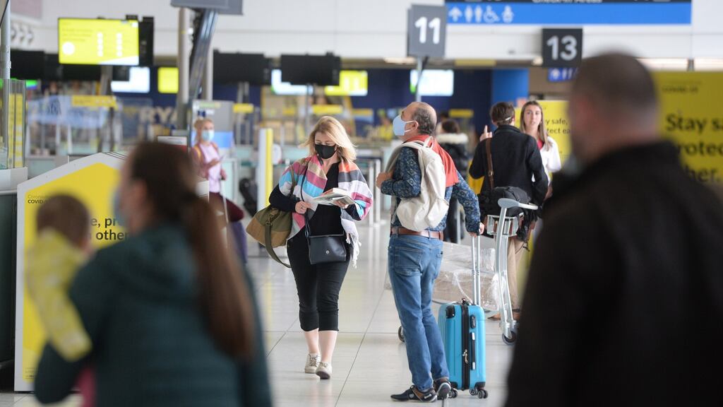Passengers at Dublin Airport prepare for their trips. Photograph: Dara Mac Dónaill