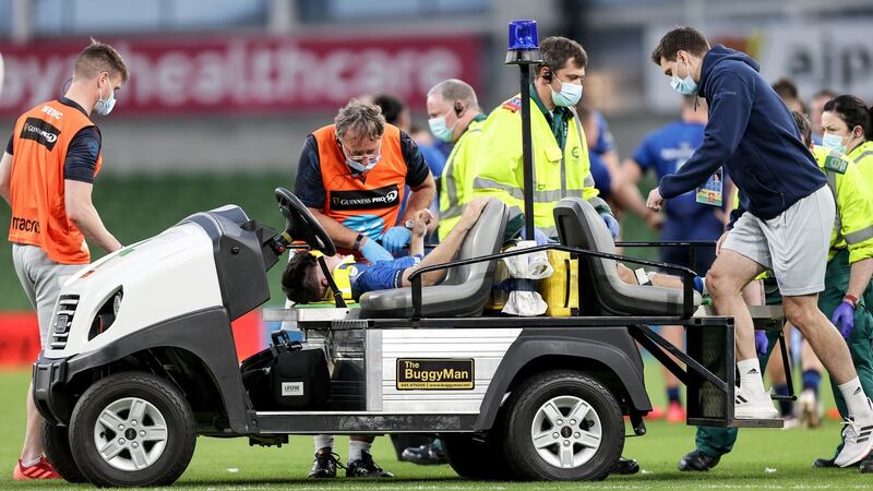 Leinster’s Chris Cosgrave is taken from the pitch after picking up an injury in the pre-season game against Harlequins at the Aviva Stadium. Photograph: Laszlo Geczo/Inpho