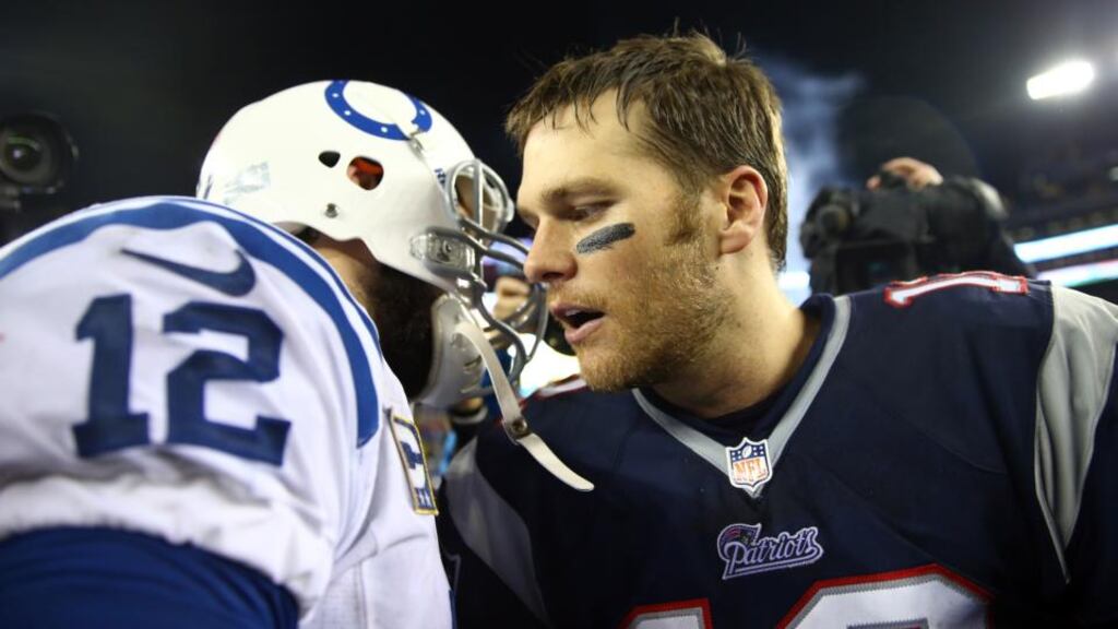 Tom Brady of the New England Patriots shakes hands with Andrew Luck (L) of the Indianapolis Colts after their AFC Divisional playoff game at Gillette Stadium  in Foxboro, Massachusetts. The New England Patriots won  43-22. Photograph:  Elsa/Getty Images