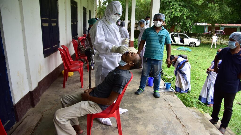 A health worker takes a nasal swab to test for Covid-19 at Barhampur village in Nagaon District of Assam, India. Photograph: Anuwar Ali Hazarika/Barcroft Media via Getty Images