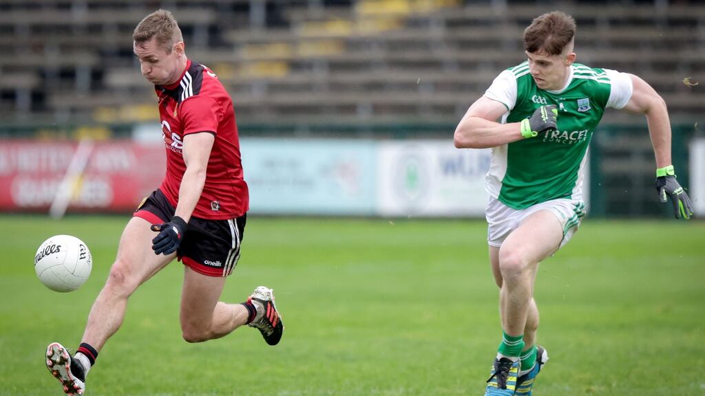 Fermanagh’s Daragh McGurn chases after Down’s Caloan Mooney during their Ulster SFC quarter-final clash. Photo: John McVitty/Inpho