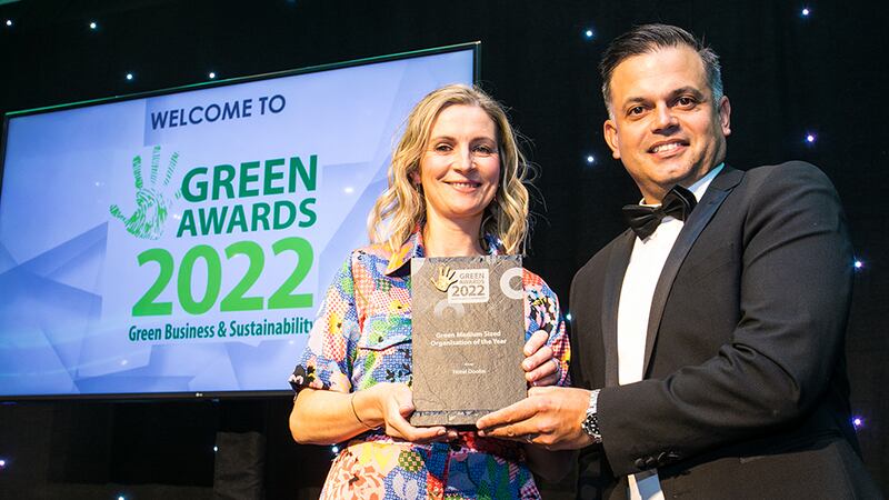 Michael Baumgart, Executive Sales Director at CBRE, presents the Green Medium Sized Organisation of the Year award to Aine Martin, Hotel Doolin.