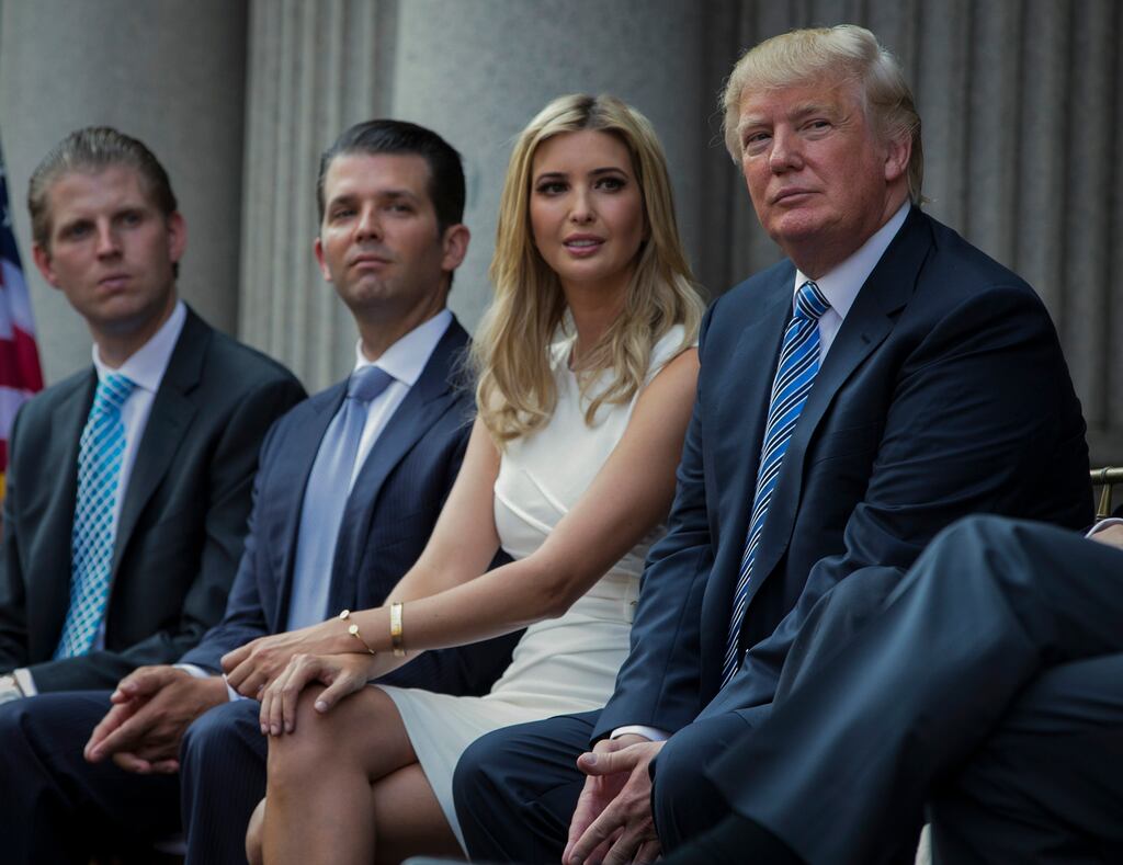 Donald Trump with his children Eric, Donald Jr and Ivanka. Photograph: Evan Vucci/AP