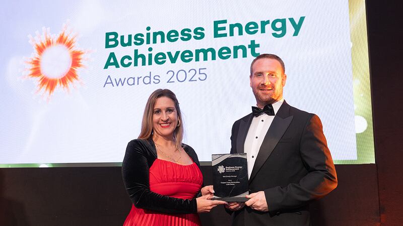 Katherine Valery, awards judge, presents the best energy manager to Luke Deasy, Copper Coast Renewables