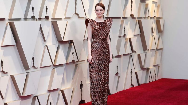 Emma Stone’s Louis Vuitton sculptural copper style divided. Photograph: Mario Anzuoni/Reuters