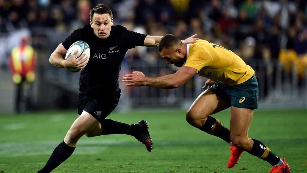 New Zealand’s Ben Smith is tackled by Australia’s Quade Cooper during the Rugby Championship match at Westpac Stadium in Wellington. Photograph: Marty Melville/AFP/Getty Images