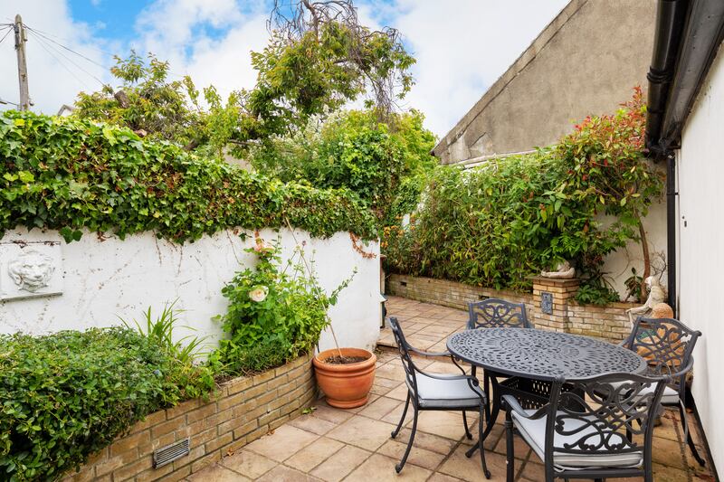 Further outdoor space is provided in the 10m (33ft) long rear garden that is now laid out as a patio with raised beds.