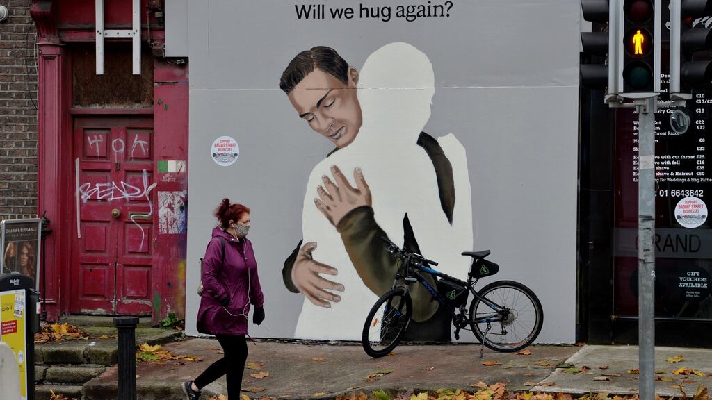 Covid-19 street art on a boarded up shop on Dublin’s Baggot Street Upper. Photograph: Alan Betson / The Irish Times.