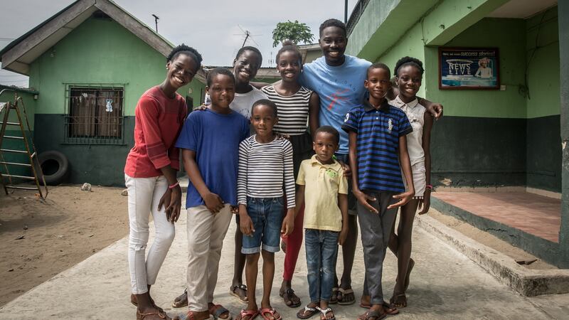 Daniel Owoseni Ajala poses with students from the Leap of Dance Academy. Photograph: Sally Hayden