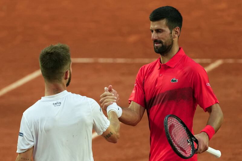 Serbia's Novak Djokovic shakes hands with France's Corentin Moutet. Photograph: Dimitar Dilkoff/AFP via Getty