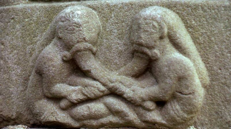 Muiredach’s cross at Monasterboice: at the foot, two men are seen pulling each other’s beards.