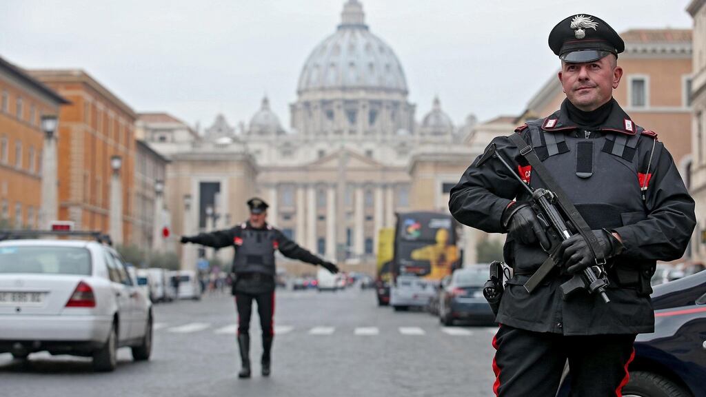 Italian Carabinieri police stand guard at a checkpoint in Conciliazione Street, next to St. Peter’s Square, in Rome, Italy: the country has upped its security measures. Photograph: Alessandro Di Meo/EPA