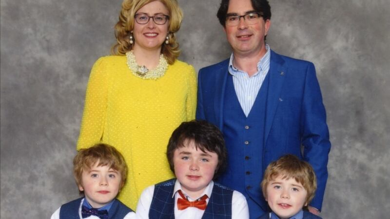 Paula and Pádraic Naughton with their three sons.