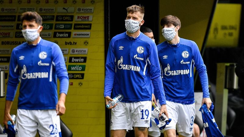 Schalke players arrive with facemasks on. Photo: Martin Meissner/AFP via Getty Images