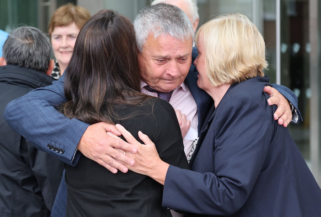 Katie Sheehan, grand-daughter of the late Nora Sheehan is hugged by family members, James and Bernie Sheehan (right) outside the Criminal Courts of Justice (CCJ) on Parkgate Street in Dublin. Photograph: Paddy Cummins