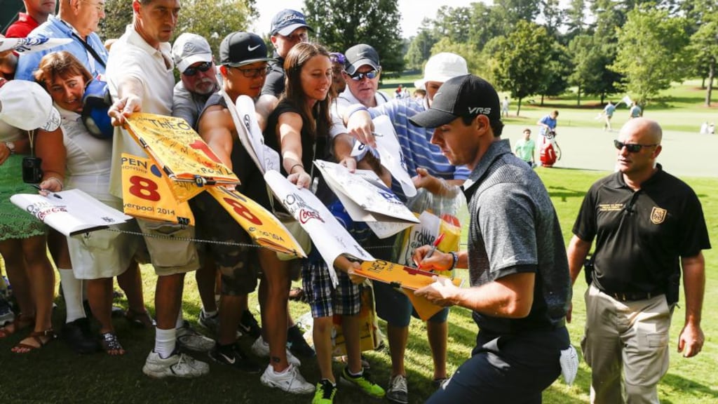 Rory McIlroy signs autographs for fans by the second green during practice for the Tour Championship at East Lake Golf Club in Atlanta, Georgia, yesterday. Photograph: Tannen Maury/EPA